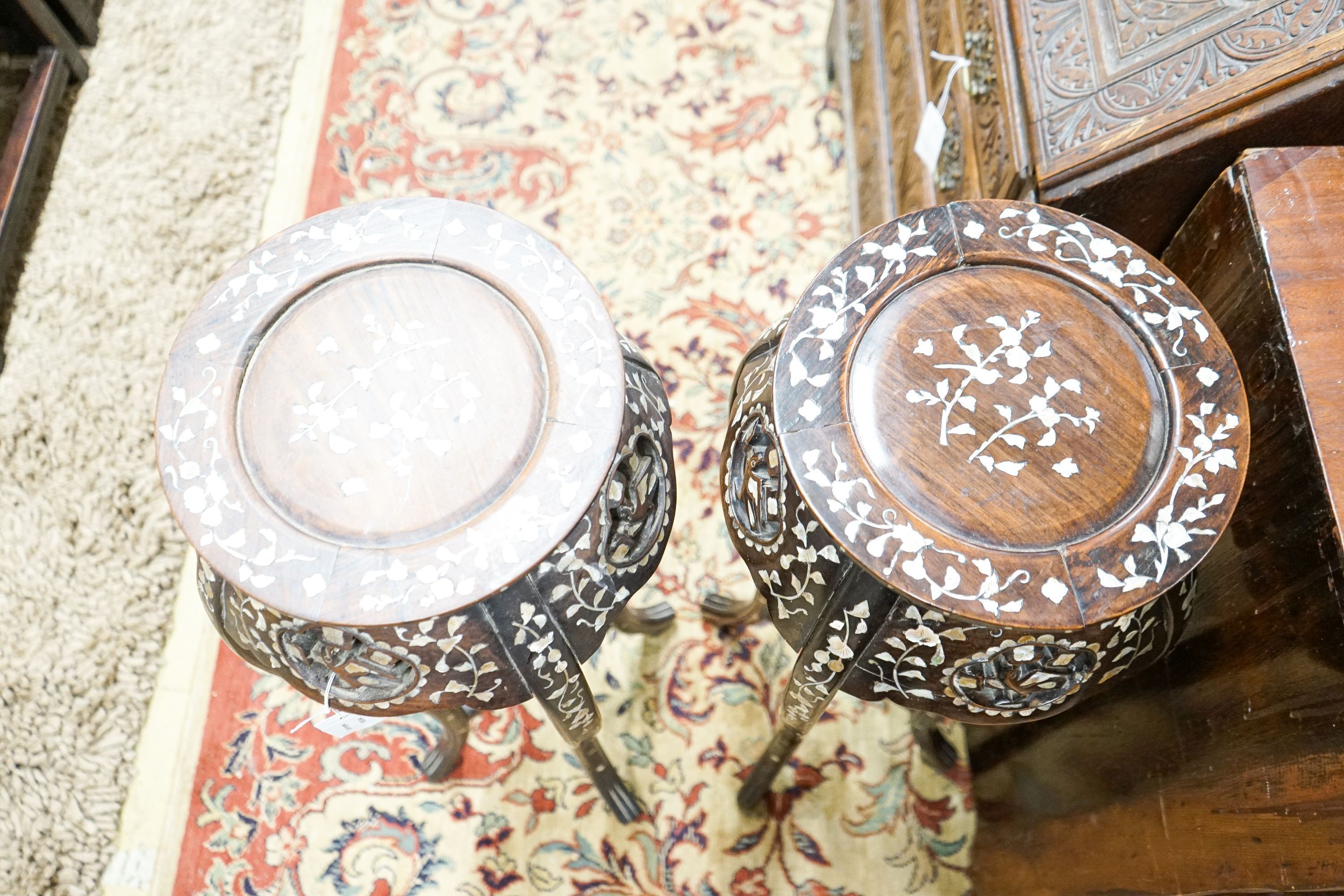 A pair of Chinese mother of pearl inset hardwood vase stands, height 92cm